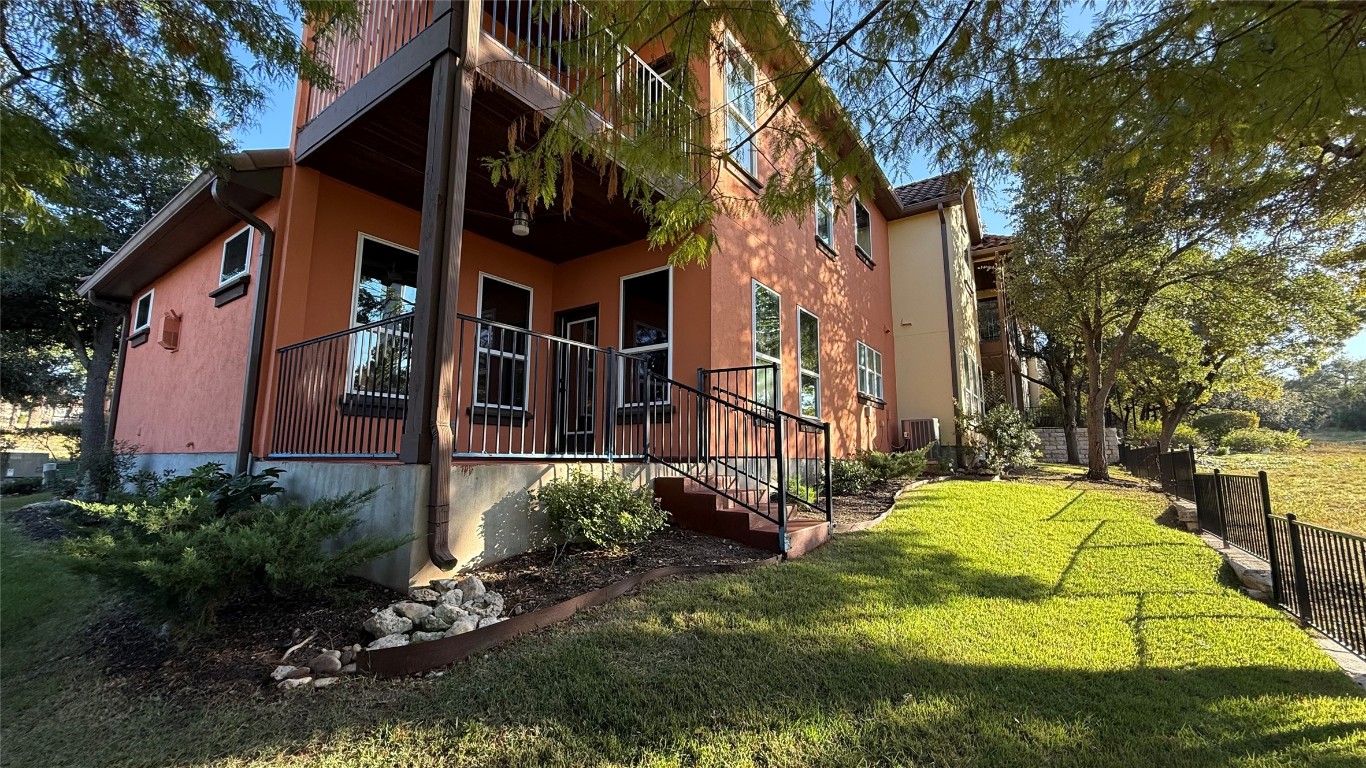 12004 Terraza Circle, Unit TH32 Austin, TX 78726 - Photo 21 of 25 a view of a house with a yard