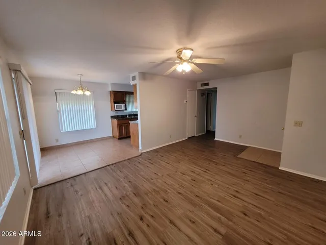 a view of a kitchen with a sink and a refrigerator