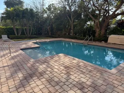 a view of swimming pool with a backyard