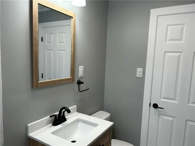 a bathroom with a sink and mirror
