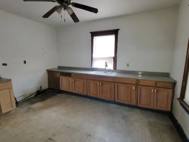 a white bath tub sitting next to a white sink