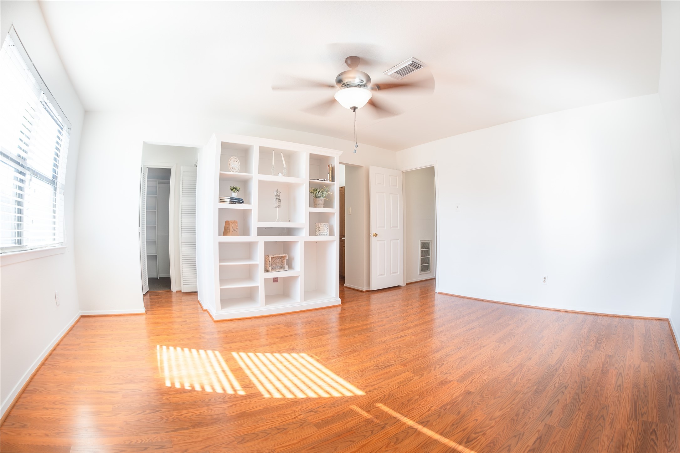 4135 Young Street Pasadena, TX 77504 - Photo 13 of 29 a view of an empty room with wooden floor and a window