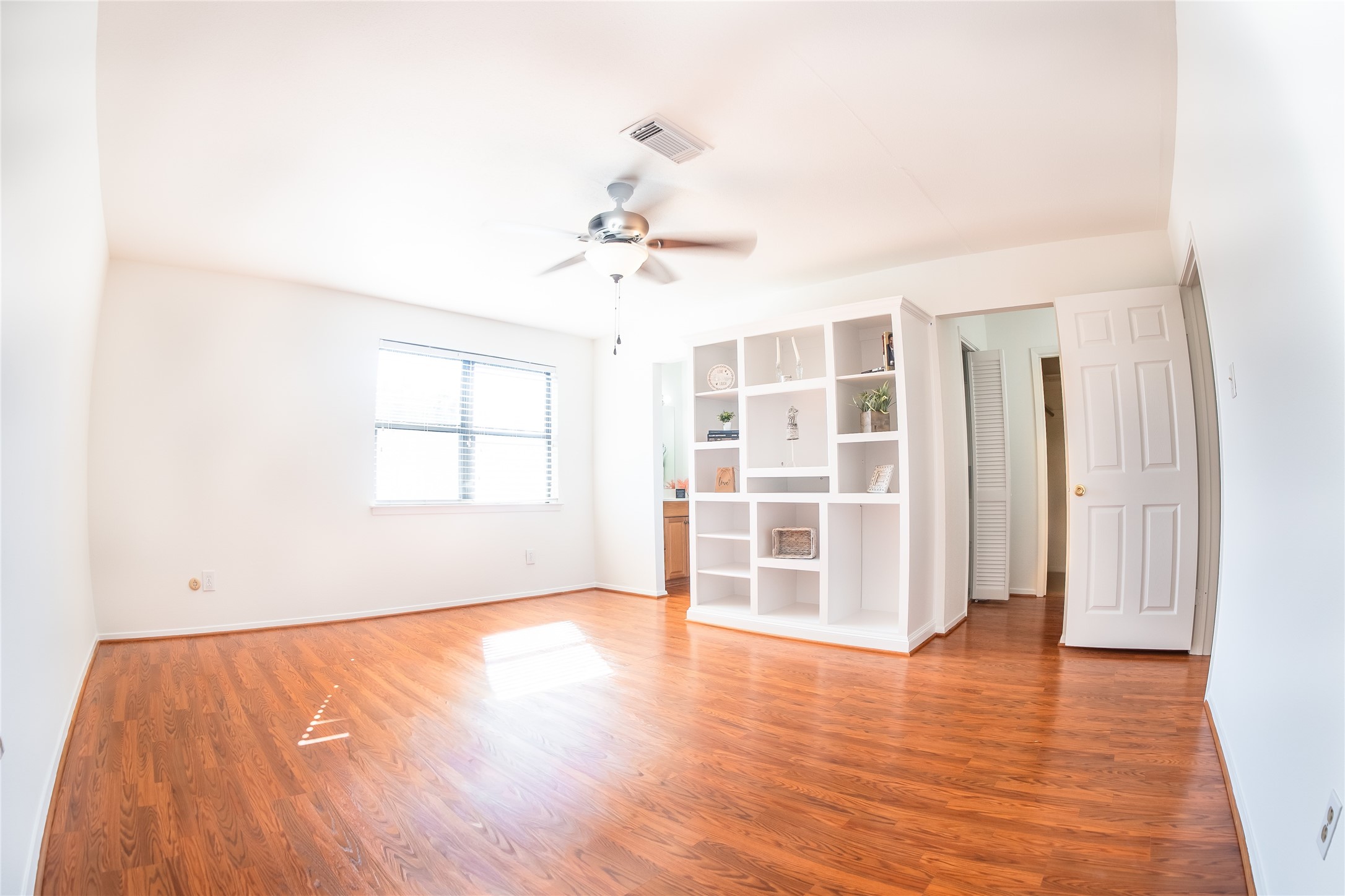 4135 Young Street Pasadena, TX 77504 - Photo 14 of 29 wooden floor in an empty room with a window