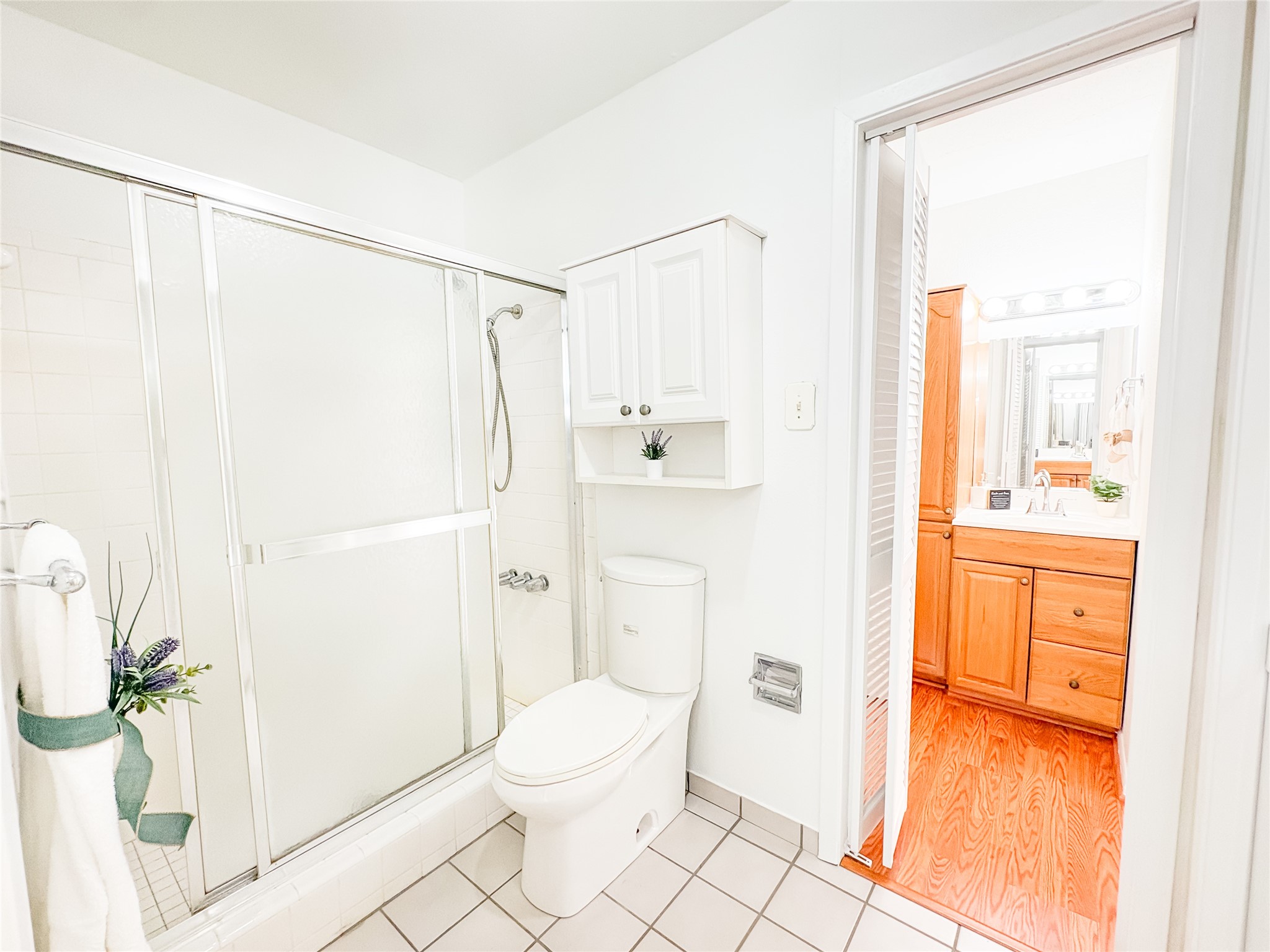 4135 Young Street Pasadena, TX 77504 - Photo 17 of 29 a bathroom with a granite countertop sink mirror vanity and toilet
