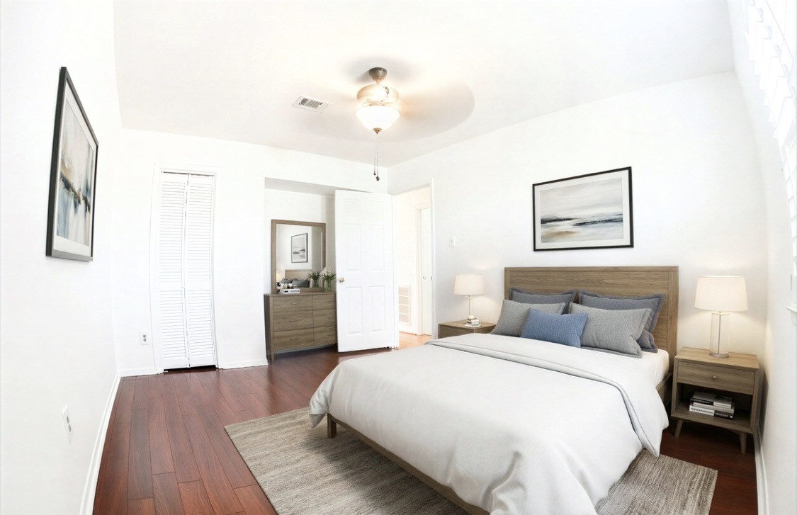 4135 Young Street Pasadena, TX 77504 - Photo 20 of 29 a bedroom with a bed and a chandelier