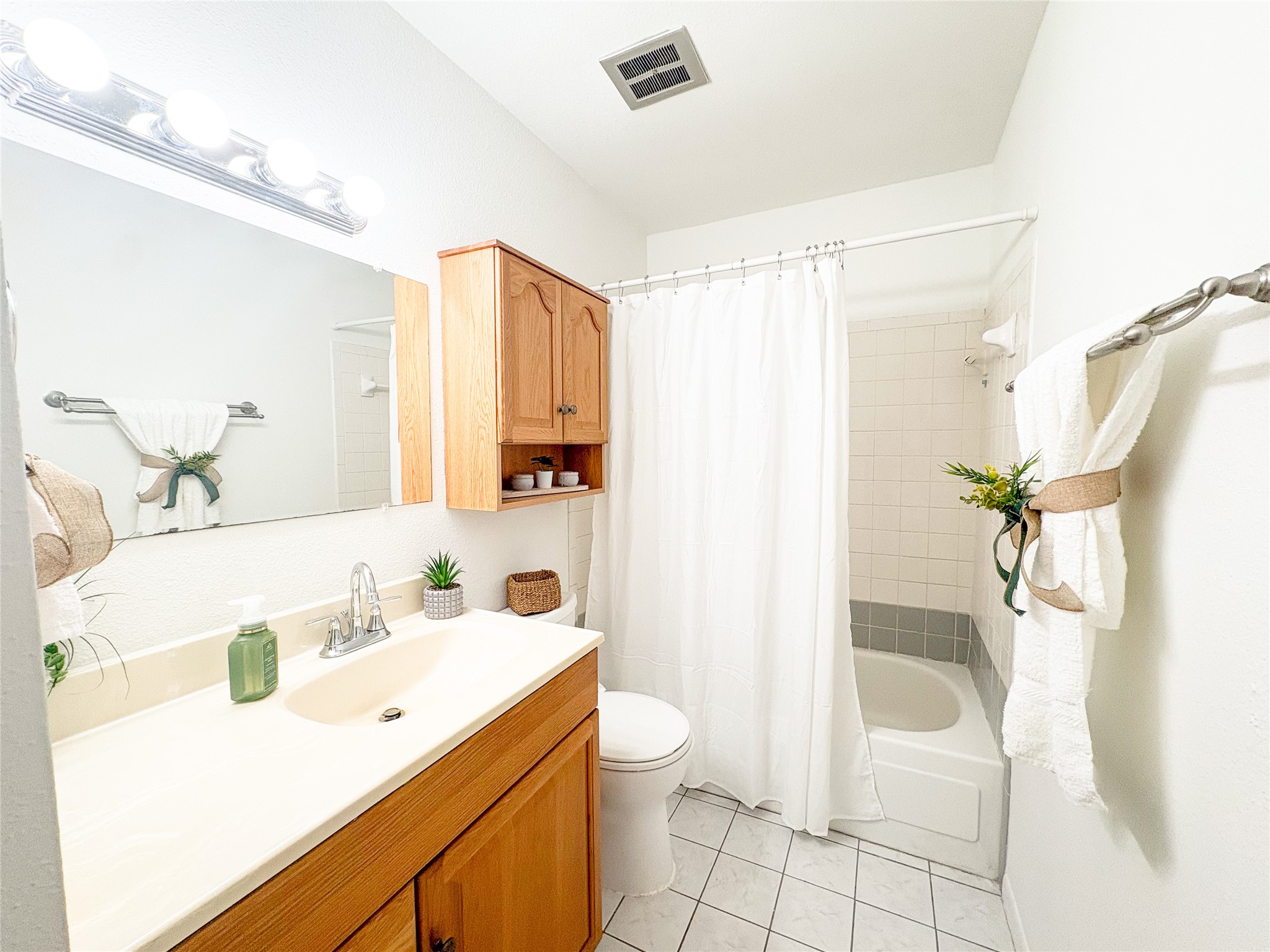 4135 Young Street Pasadena, TX 77504 - Photo 21 of 29 a bathroom with a sink a toilet and shower
