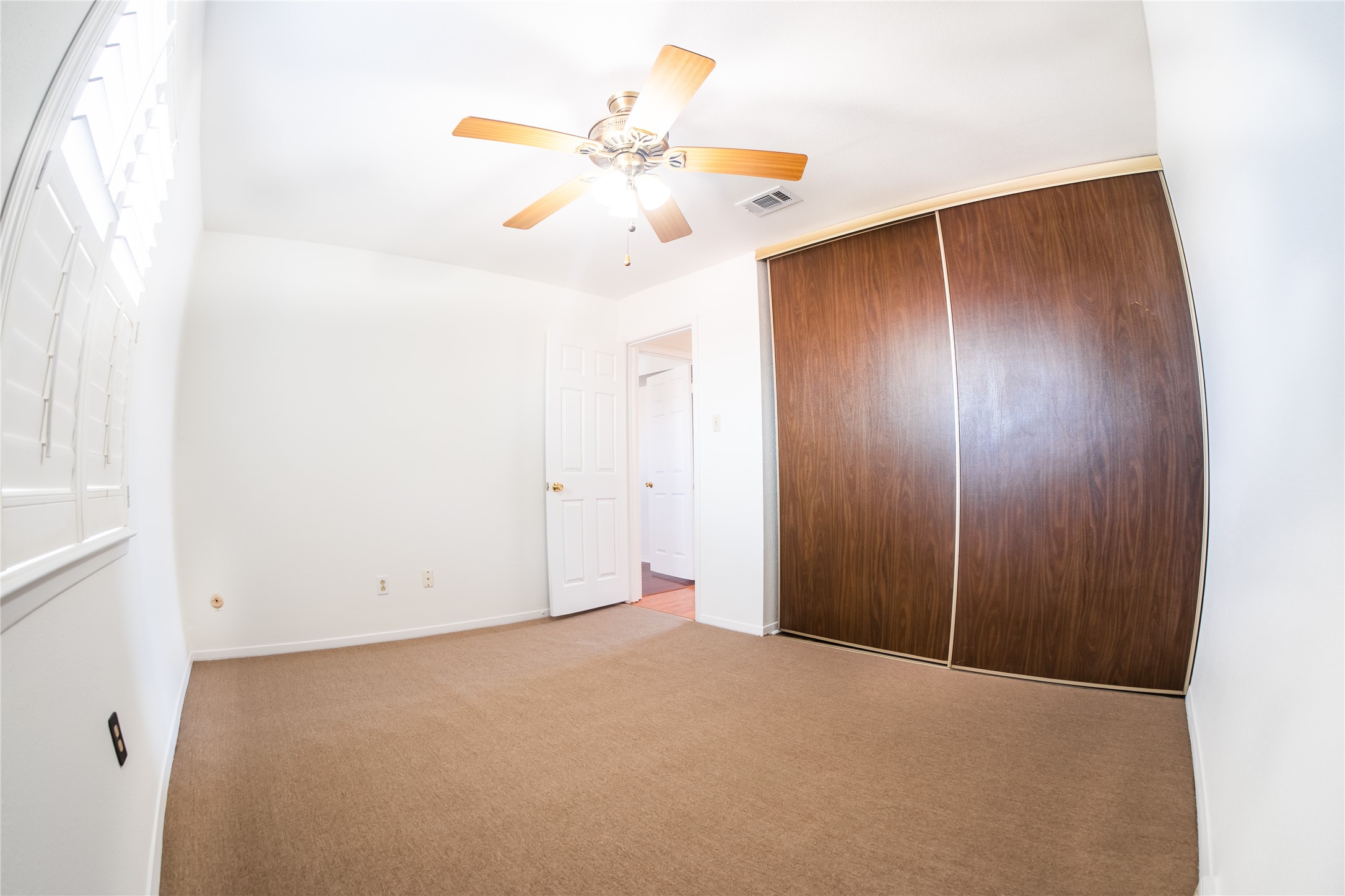 4135 Young Street Pasadena, TX 77504 - Photo 22 of 29 an empty room with fan