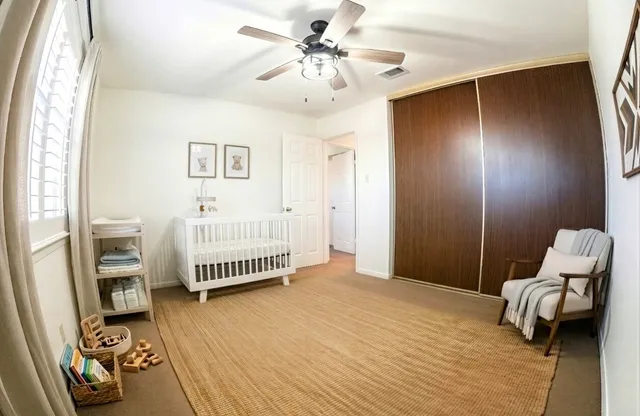 a bedroom with a bed and a couch