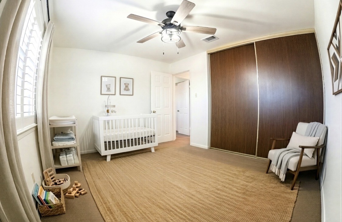 4135 Young Street Pasadena, TX 77504 - Photo 23 of 29 a bedroom with a bed and a couch