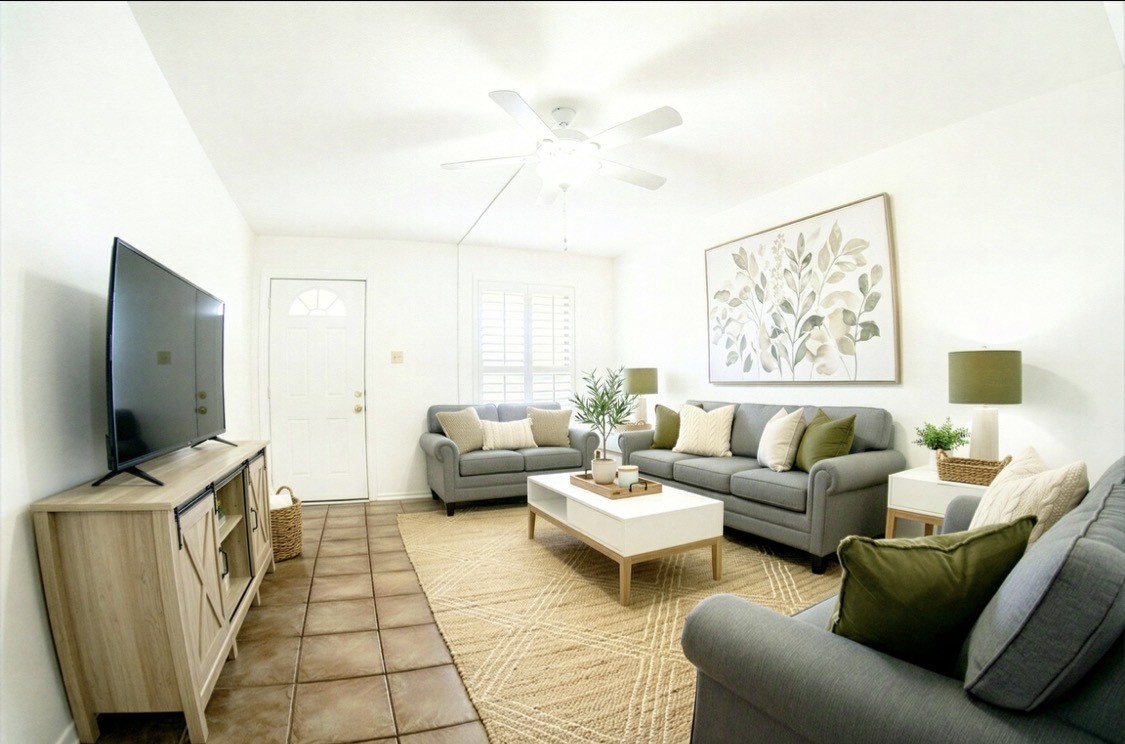 4135 Young Street Pasadena, TX 77504 - Photo 3 of 29 a living room with furniture and a flat screen tv