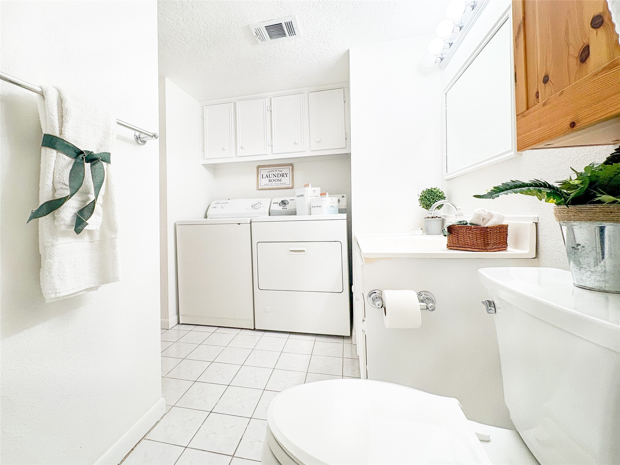 4135 Young Street Pasadena, TX 77504 - Photo 8 of 29 a bathroom with a sink a toilet and mirror