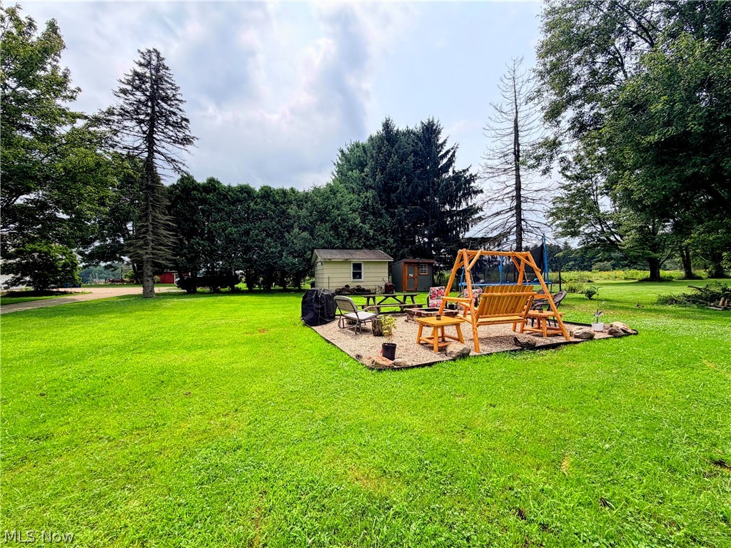 728 Johnson Plank Road Warren, OH 44481 - Photo 20 of 24 Backyard with sitting area and fire pit