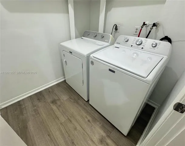 a utility room with dryer and washer