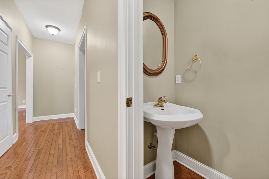 220 Oak Rdg Lane Ellijay, GA 30536 - Photo 15 of 36 a bathroom with a sink a mirror and a shower
