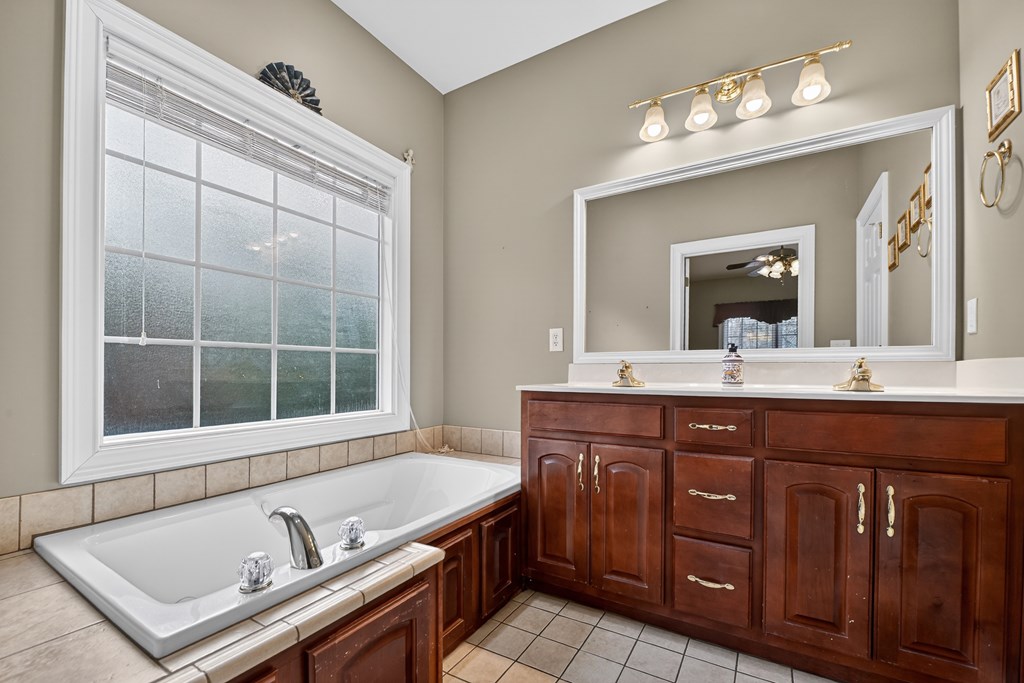220 Oak Rdg Lane Ellijay, GA 30536 - Photo 17 of 36 a bathroom with a sink double vanity and a mirror