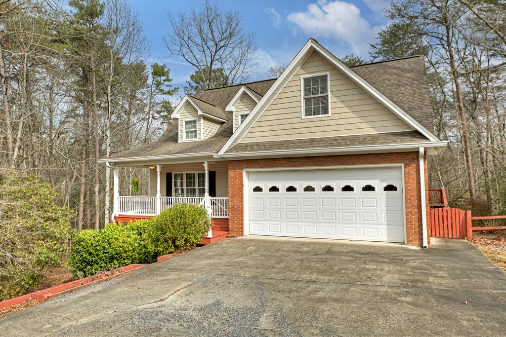 220 Oak Rdg Lane Ellijay, GA 30536 - Photo 2 of 36 a front view of a house with a yard and garage