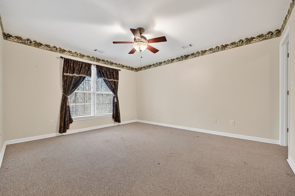220 Oak Rdg Lane Ellijay, GA 30536 - Photo 22 of 36 an empty room with windows and fan