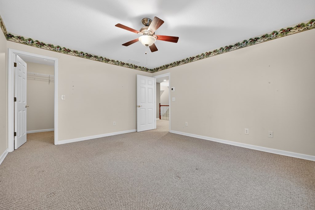 220 Oak Rdg Lane Ellijay, GA 30536 - Photo 23 of 36 an empty room with closet and windows