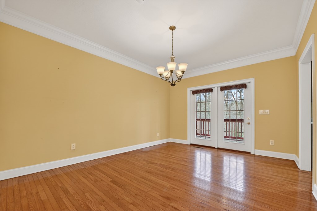 220 Oak Rdg Lane Ellijay, GA 30536 - Photo 10 of 36 a view of an empty room with wooden floor and a window