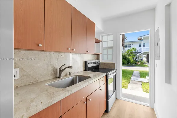 a kitchen with sink cabinets and outdoor