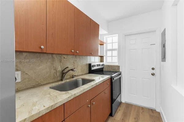 a kitchen with a sink and cabinets