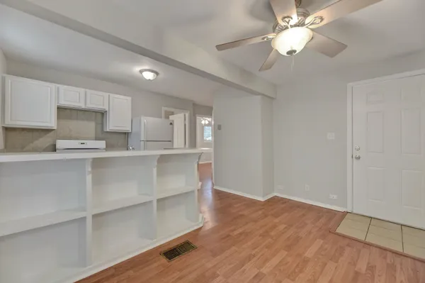 a view of kitchen with wooden floor and window