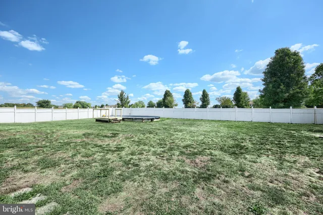 a view of outdoor space with deck and yard