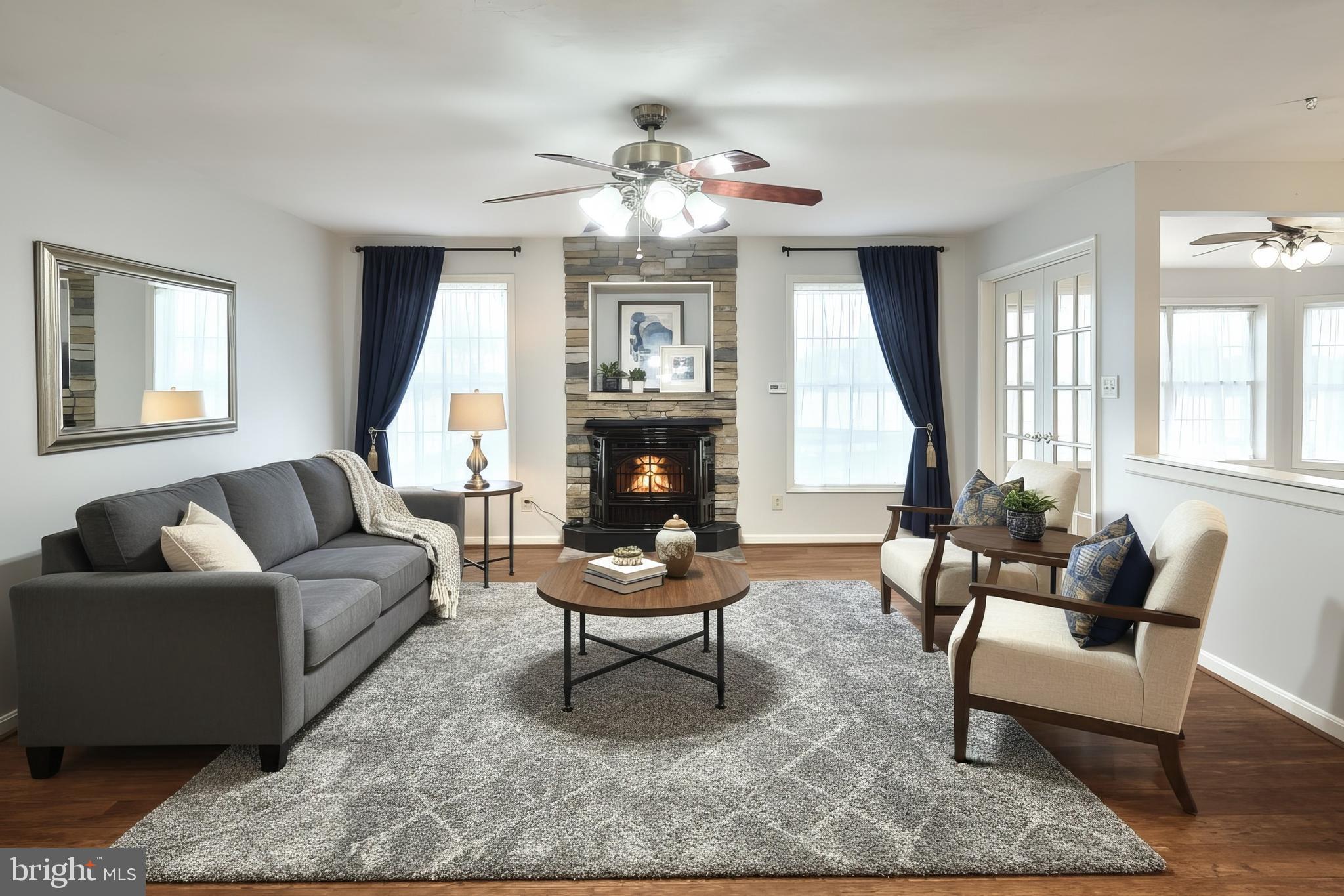 37 Amanda Drive Littlestown, PA 17340 - Photo 22 of 70 a living room with furniture a fireplace and a chandelier