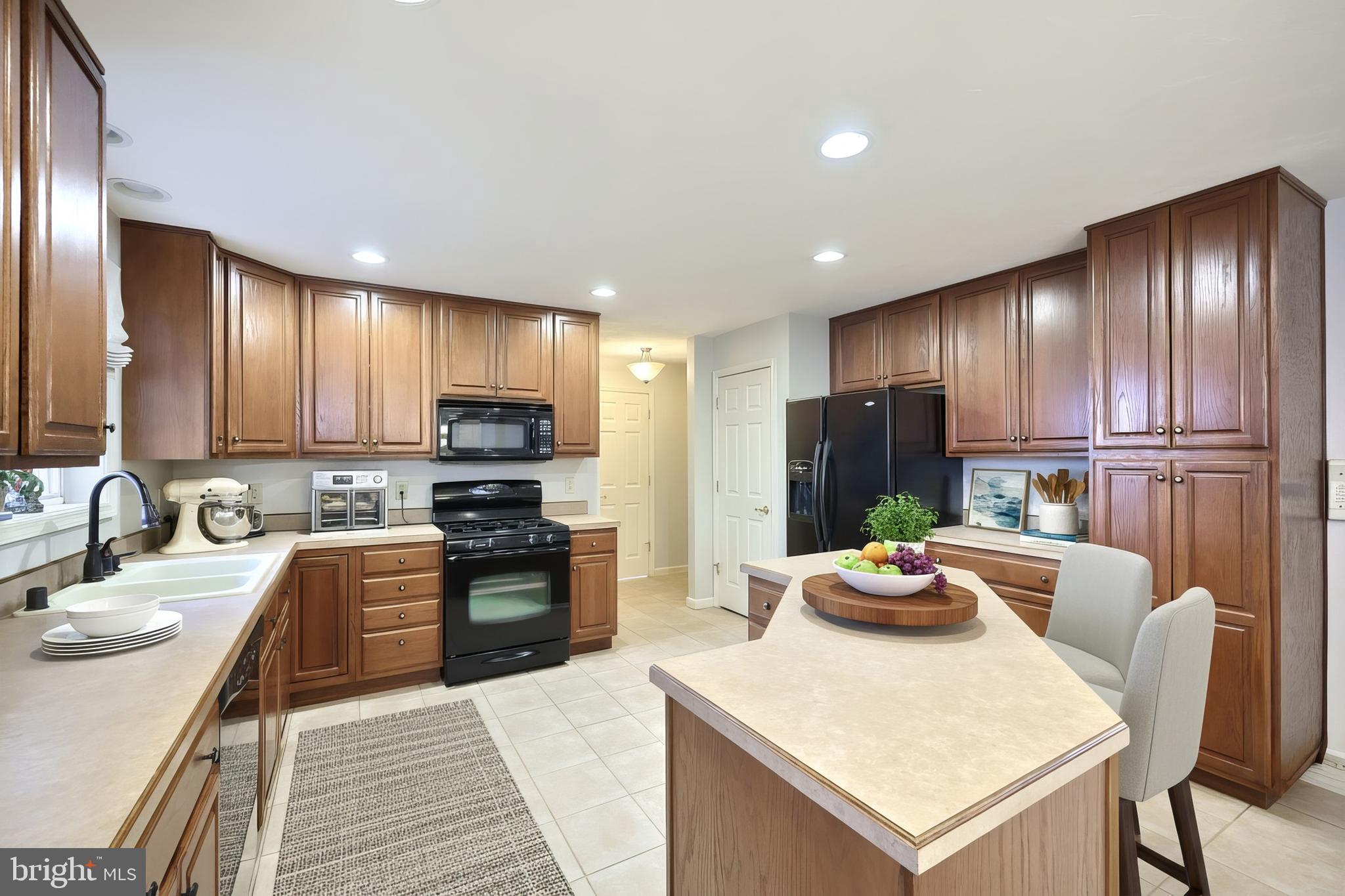 37 Amanda Drive Littlestown, PA 17340 - Photo 34 of 70 a kitchen with stainless steel appliances granite countertop a refrigerator stove top oven a sink and dishwasher