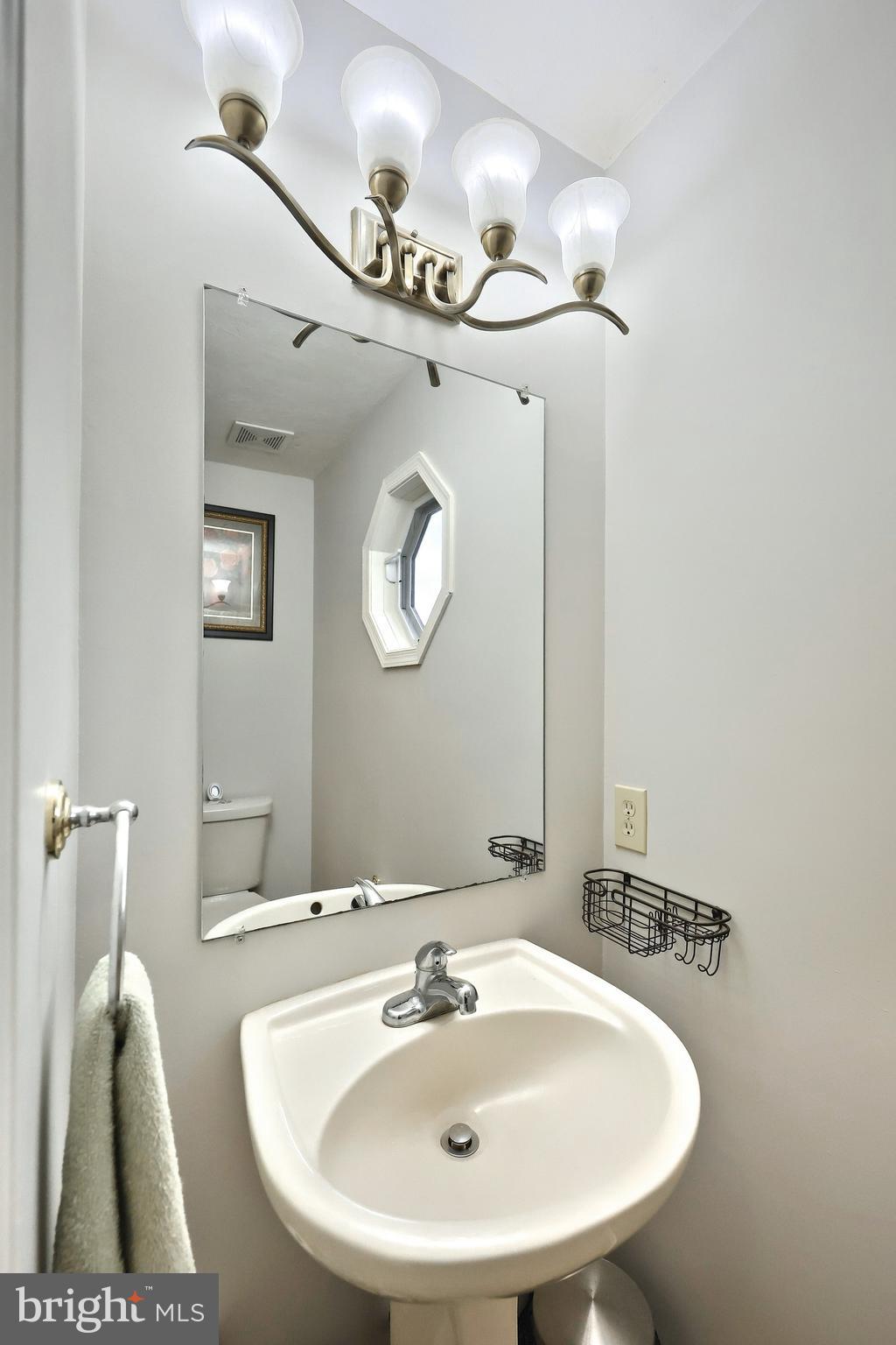 37 Amanda Drive Littlestown, PA 17340 - Photo 39 of 70 a bathroom with a sink and a mirror