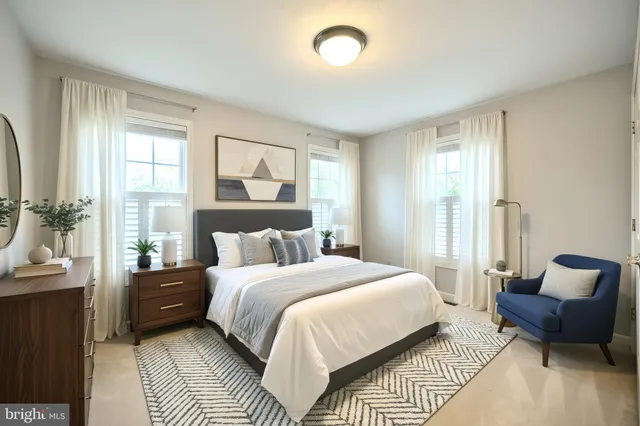 an empty room with closet and windows