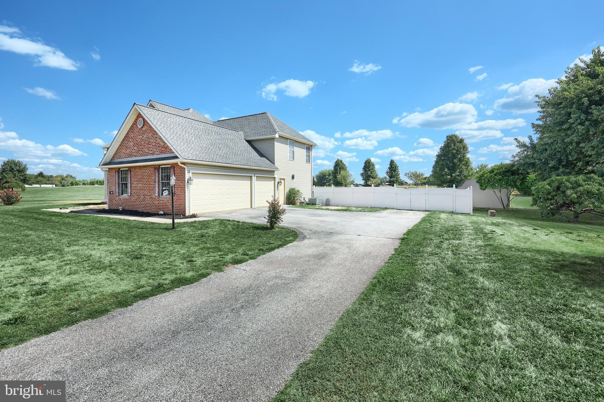 37 Amanda Drive Littlestown, PA 17340 - Photo 5 of 70 a front view of a house with a yard and garage