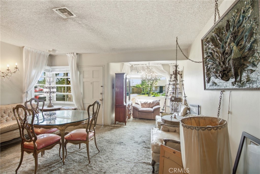 615 North Grandee Avenue Compton, CA 90220 - Photo 4 of 14 a living room with furniture and a large window