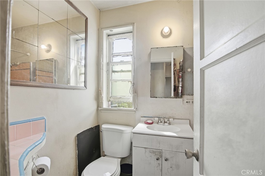 615 North Grandee Avenue Compton, CA 90220 - Photo 7 of 14 a bathroom with a sink toilet and mirror