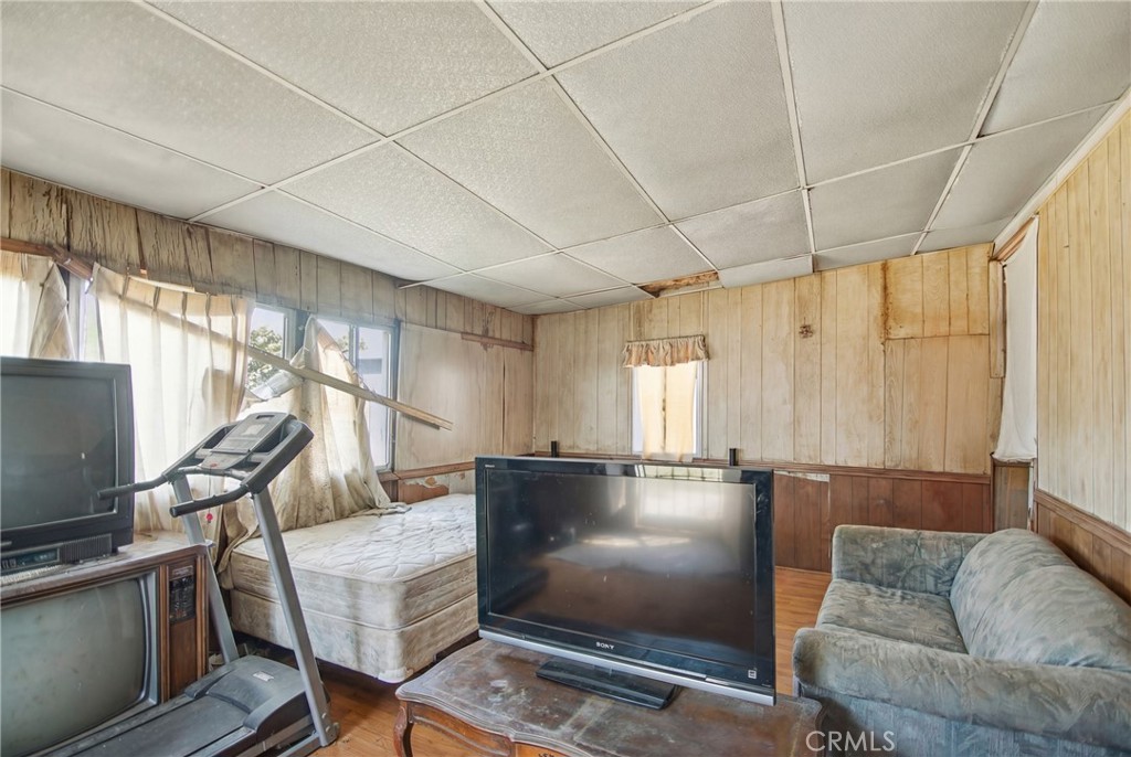 615 North Grandee Avenue Compton, CA 90220 - Photo 10 of 14 a living room with furniture and a flat screen tv