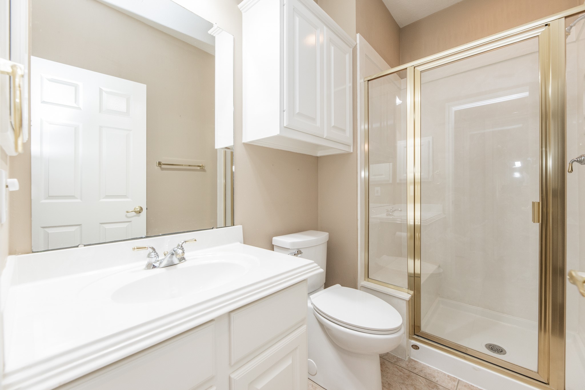 1222 Brinson Court Spring, TX 77379 - Photo 33 of 35 a bathroom with a sink toilet and shower