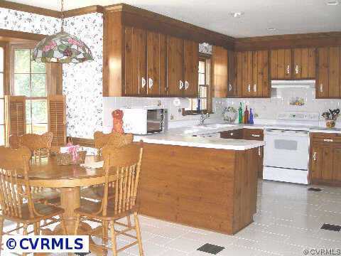 5321 Copperpenny Road Chesterfield, VA 23832 - Photo 3 of 10 a kitchen with stainless steel appliances granite countertop a sink window and cabinets