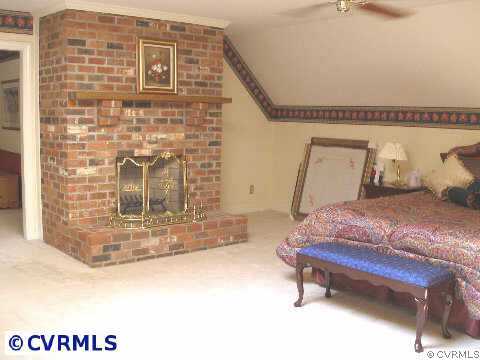 5321 Copperpenny Road Chesterfield, VA 23832 - Photo 5 of 10 a bedroom with a bed and a potted plant on it