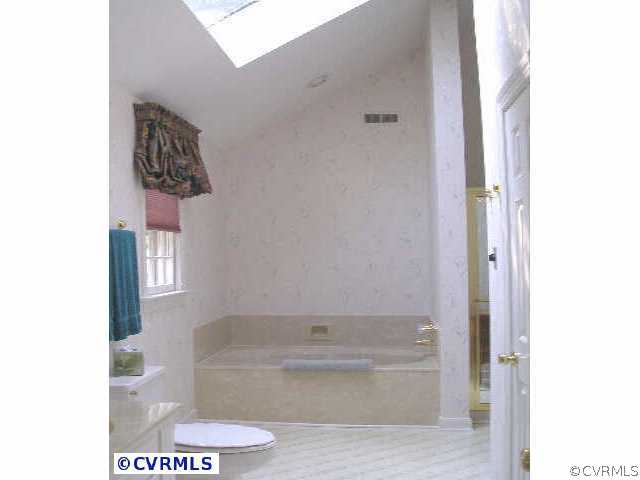5321 Copperpenny Road Chesterfield, VA 23832 - Photo 6 of 10 a bathroom with a bathtub and shower