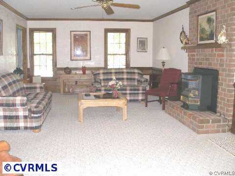 5321 Copperpenny Road Chesterfield, VA 23832 - Photo 7 of 10 a living room with furniture and a fireplace