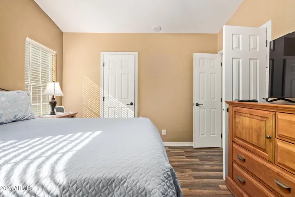 a yellow house with trees in front of it