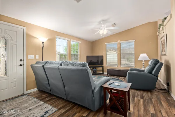 a living room with furniture and a flat screen tv