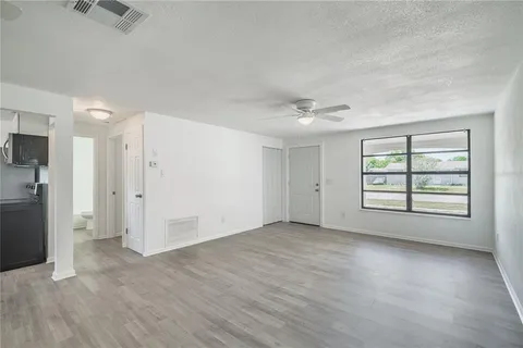 a view of an empty room with a window