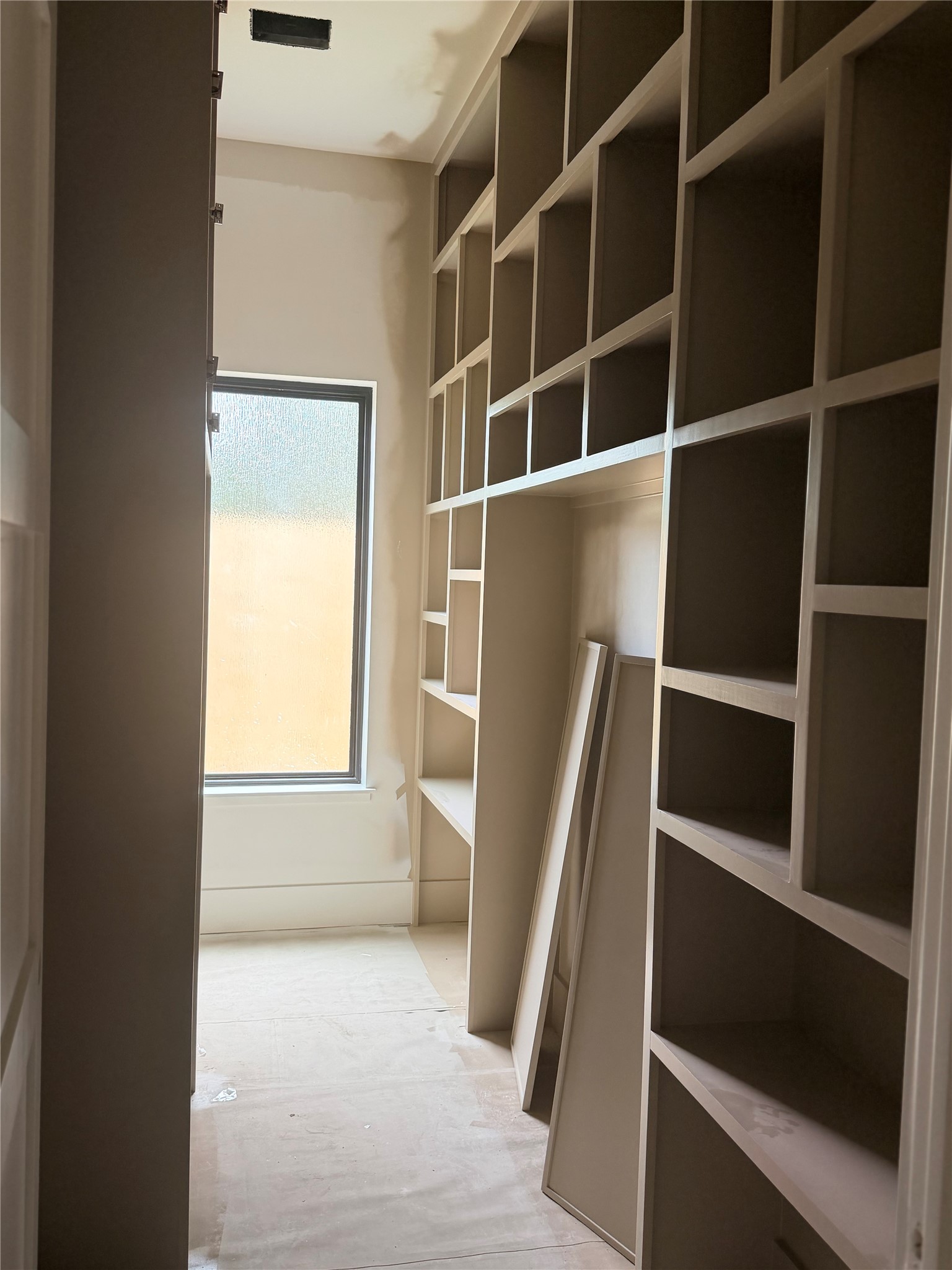 2518 Southline Road Conroe, TX 77384 - Photo 6 of 17 a view of walk in closet with empty racks