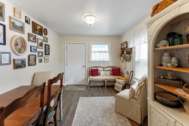a view of a livingroom with furniture and a window