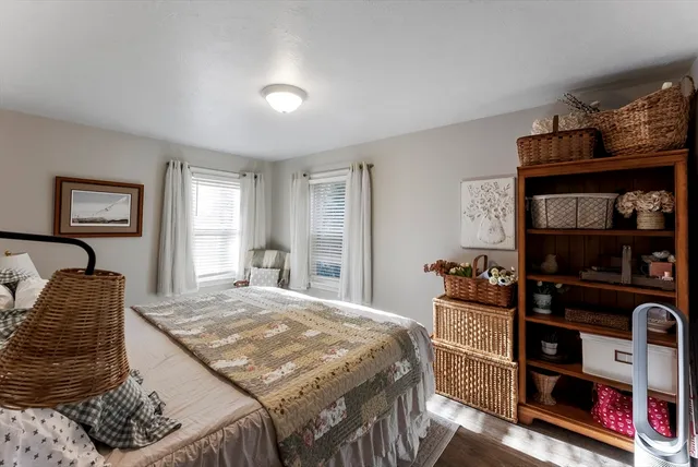 a bedroom with a bed and dresser