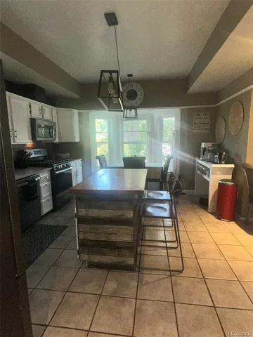 a bed sitting in a bedroom next to a cabinet