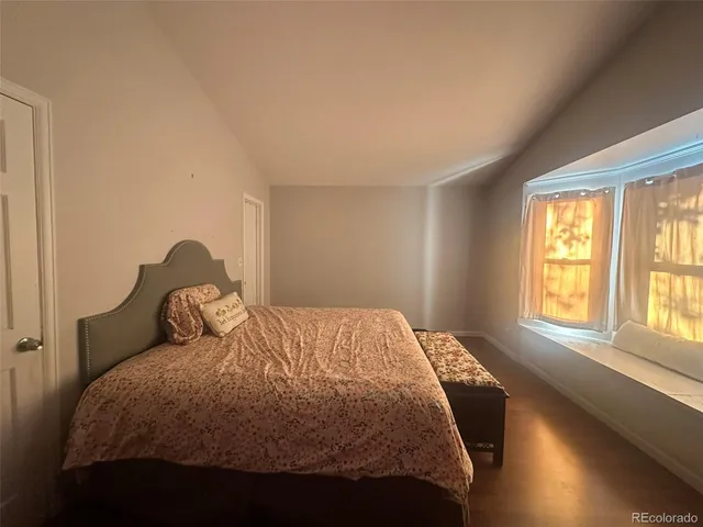 a view of a hallway with paintings on the wall