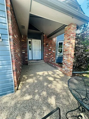 a kitchen with granite countertop a stove and cabinets