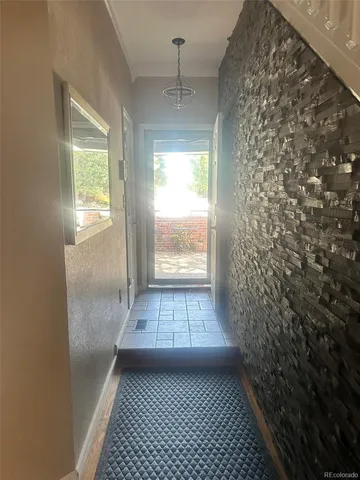a kitchen with a sink a counter space appliances and cabinets